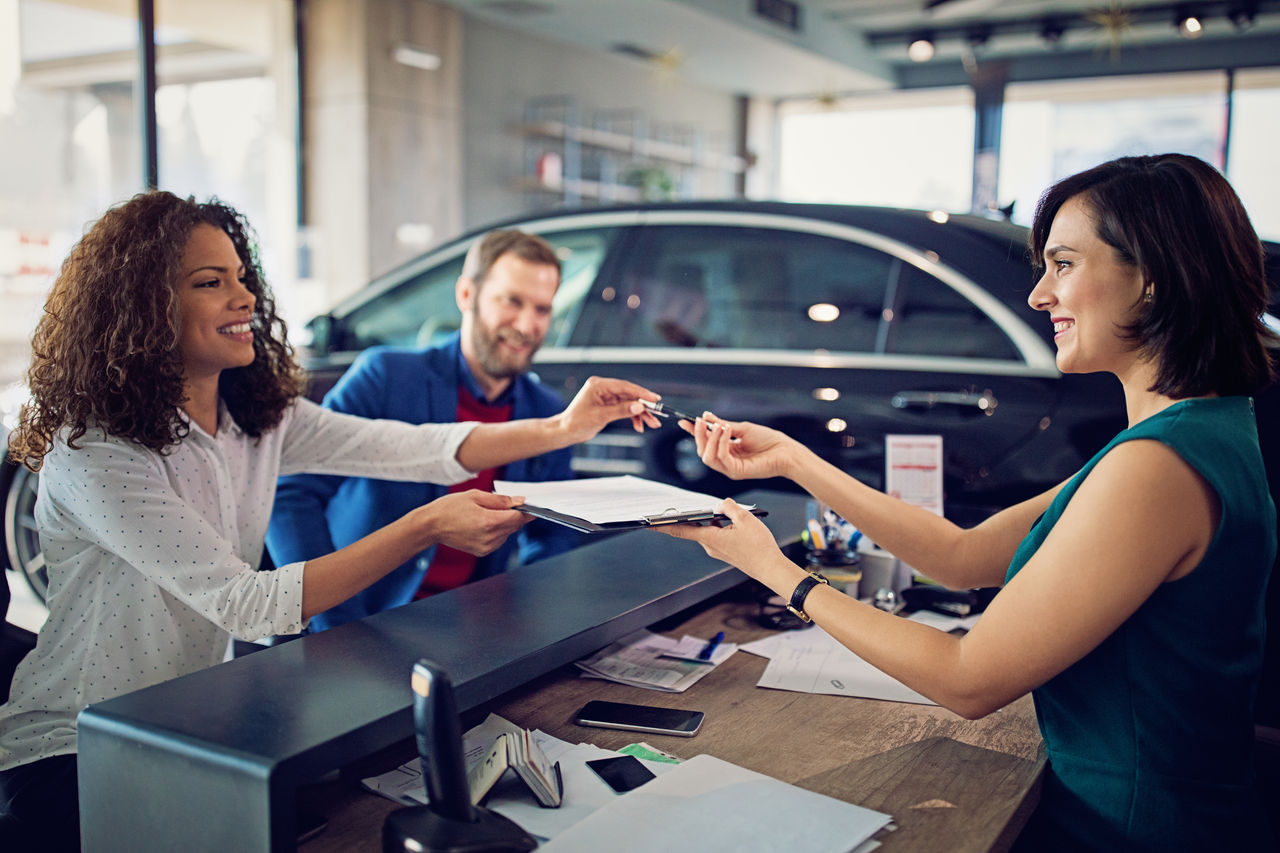 false Couple is buying new car and signing the contract