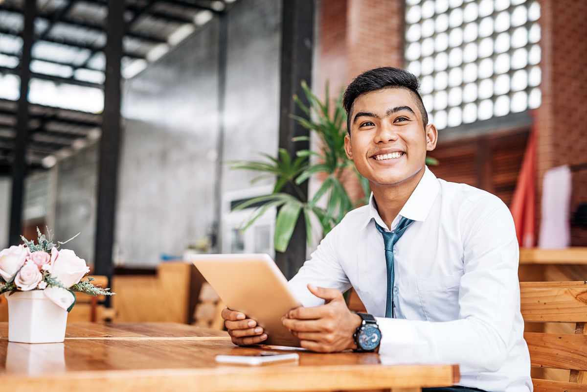 Young Thai businessman or entrepreneur developing start up project by using al communication tools